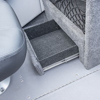 Tiroir de rangement sous la console passager